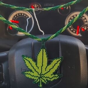 Hand beaded necklace and cannabis weed leaf emblem